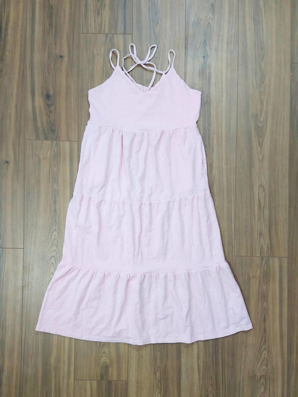 Pretty pink sundress. Tired style with adjustable tie back straps. Size small.